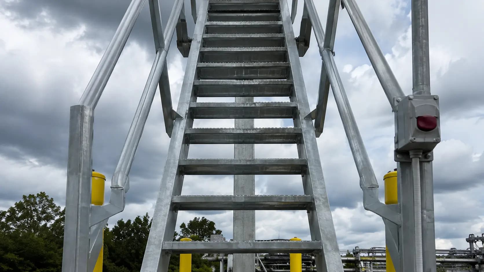 Fabricated steel stair tower with switchback stairs against the sky