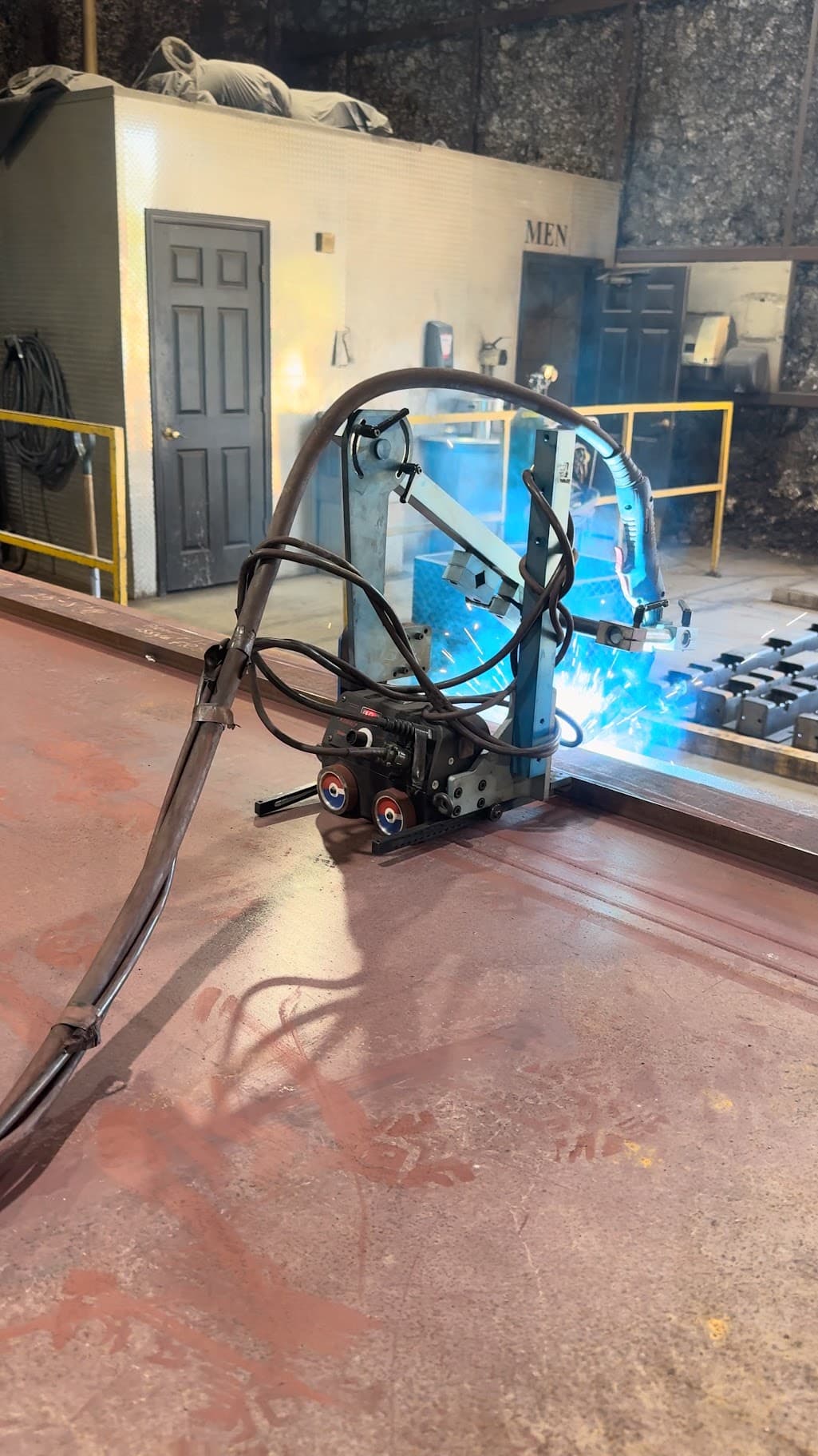 Welding operation on fabricated steel with fixtures
