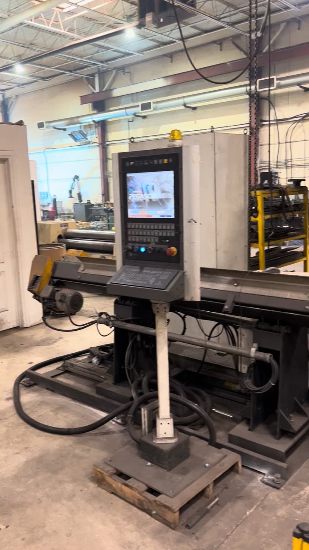 CNC machine control panel and press in the shop