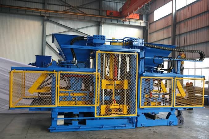 Automated production machine with yellow safety guarding