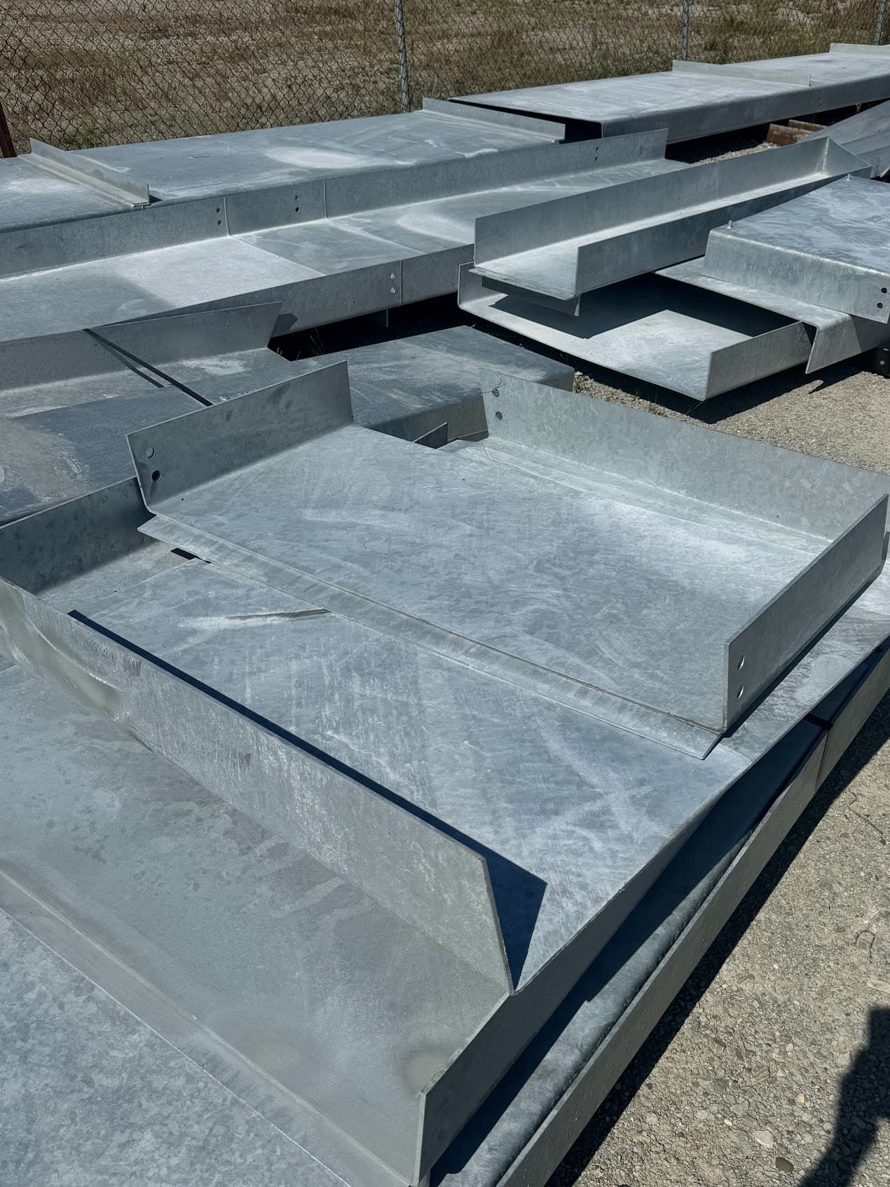Close view of a galvanized formed steel plate component