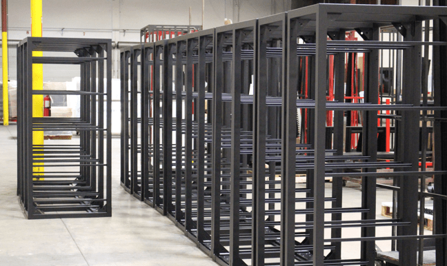 Black-painted fabricated steel rack structures in the shop