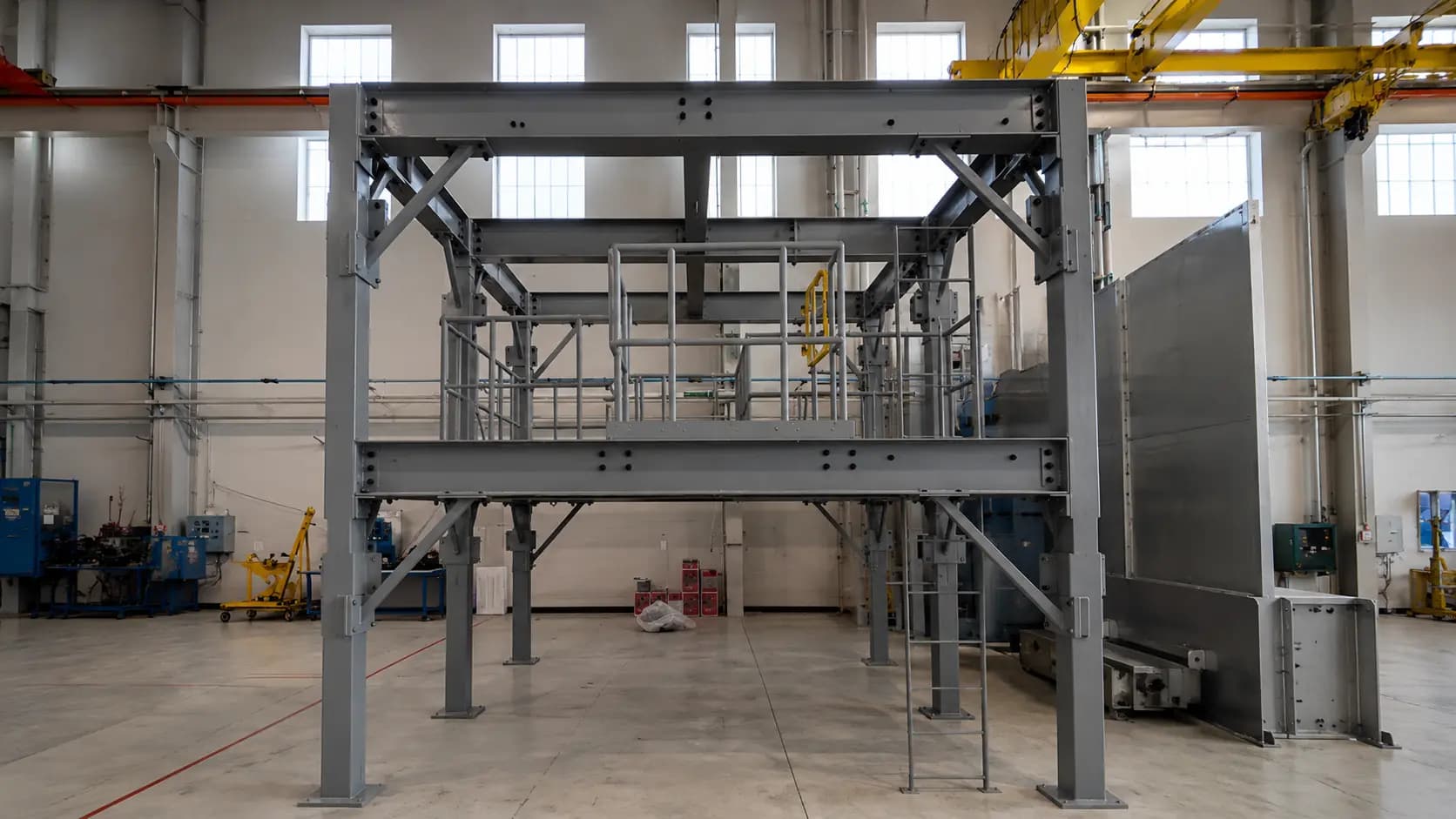 Fabricated steel platform structure with beams indoors