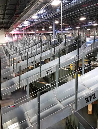 Elevated conveyor and catwalk structure with zone signage