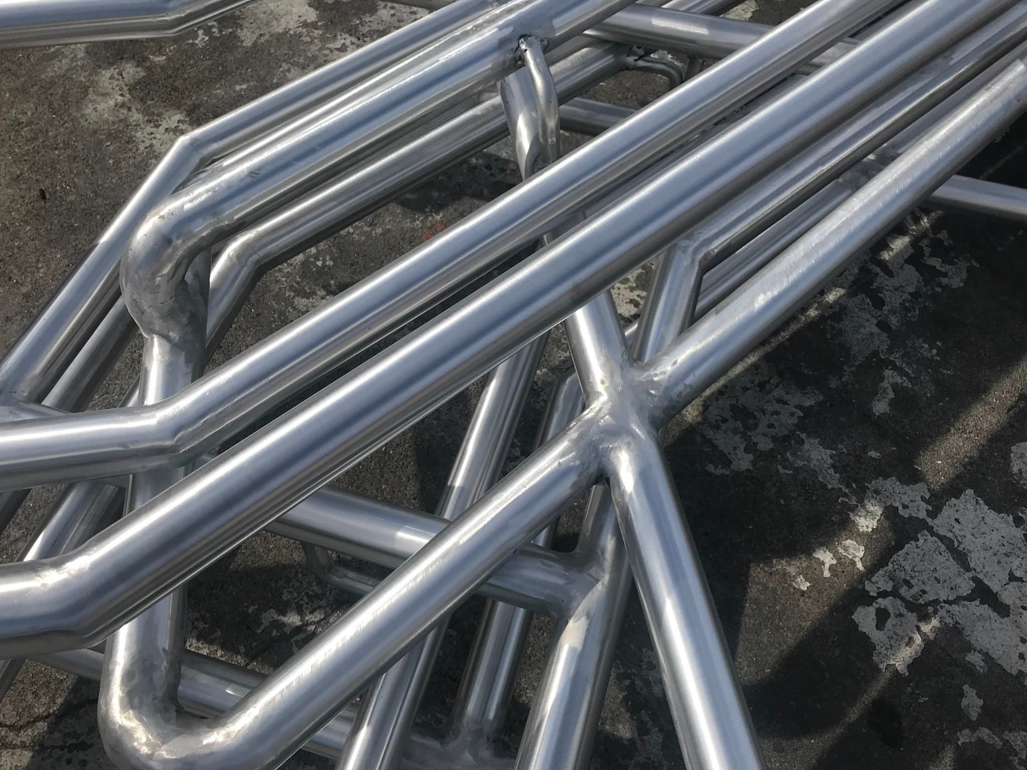 Polished stainless steel tubular frame assembly