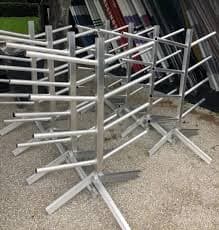 Fabricated steel tubular frame assemblies staged on gravel