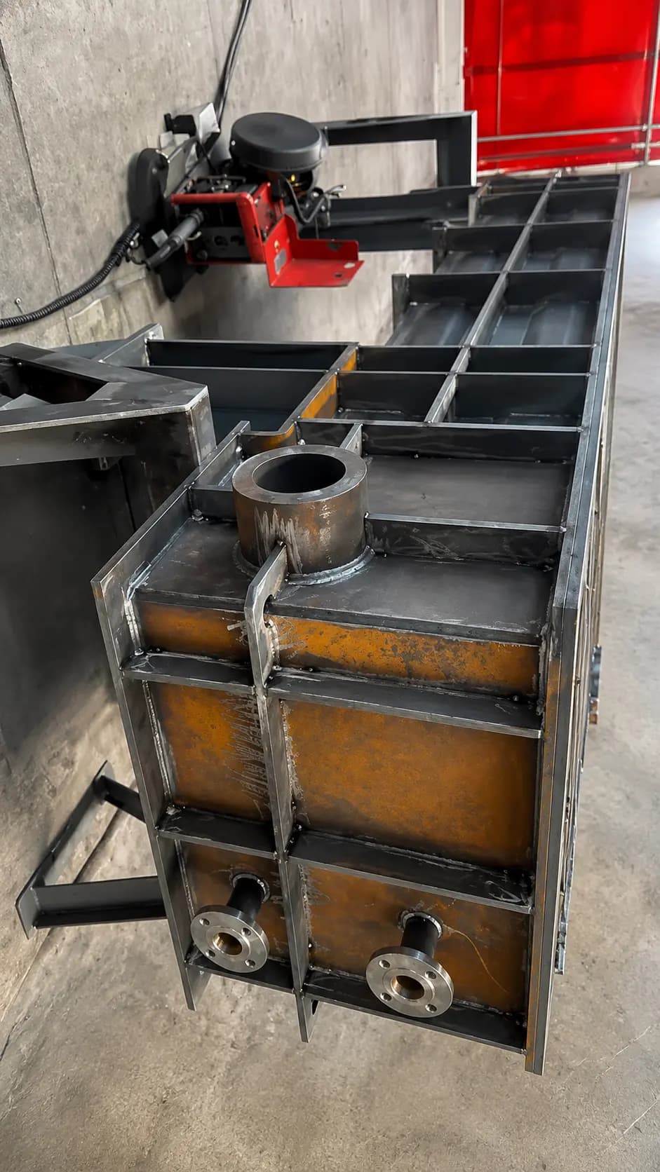 Stainless fabricated equipment housing with welded pipe connection