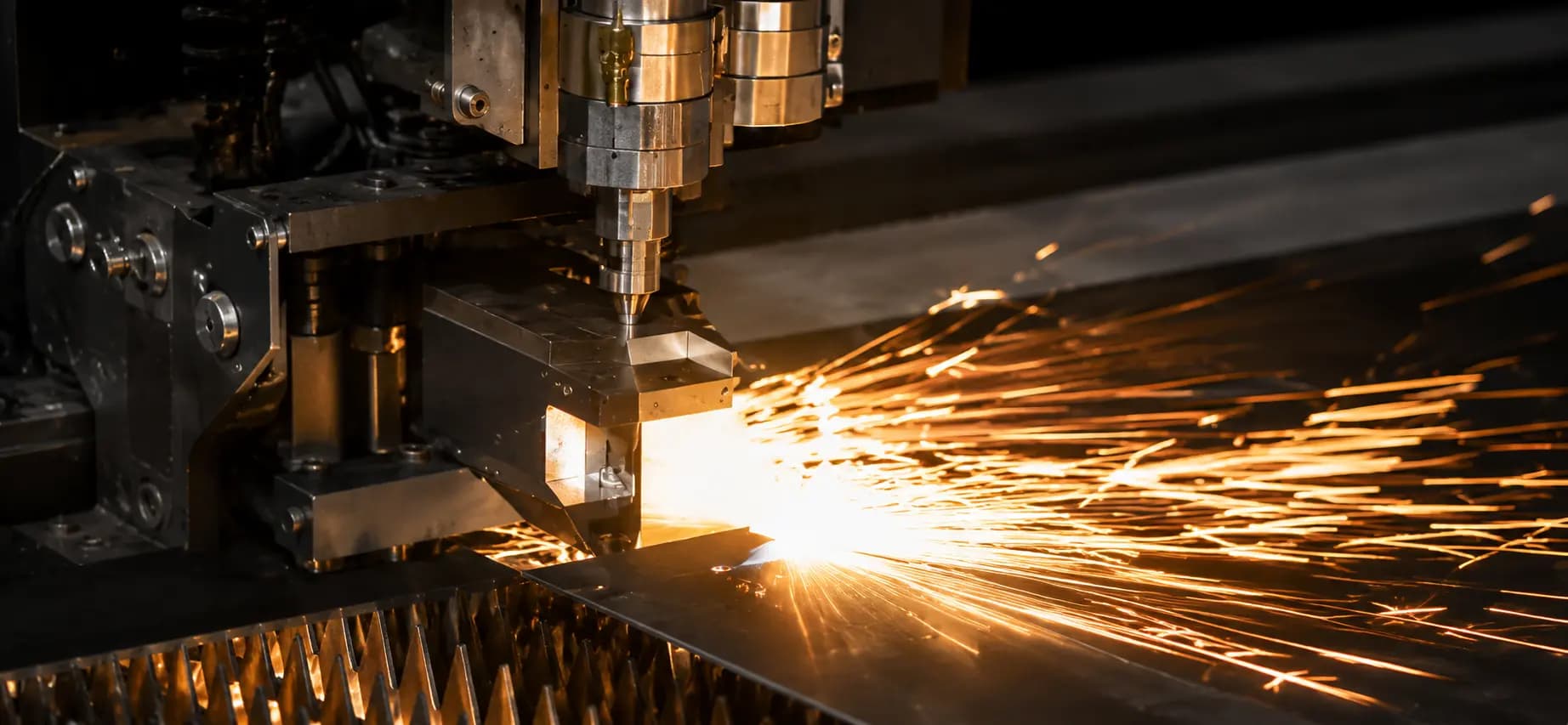 Tube laser cutting profile features with sparks