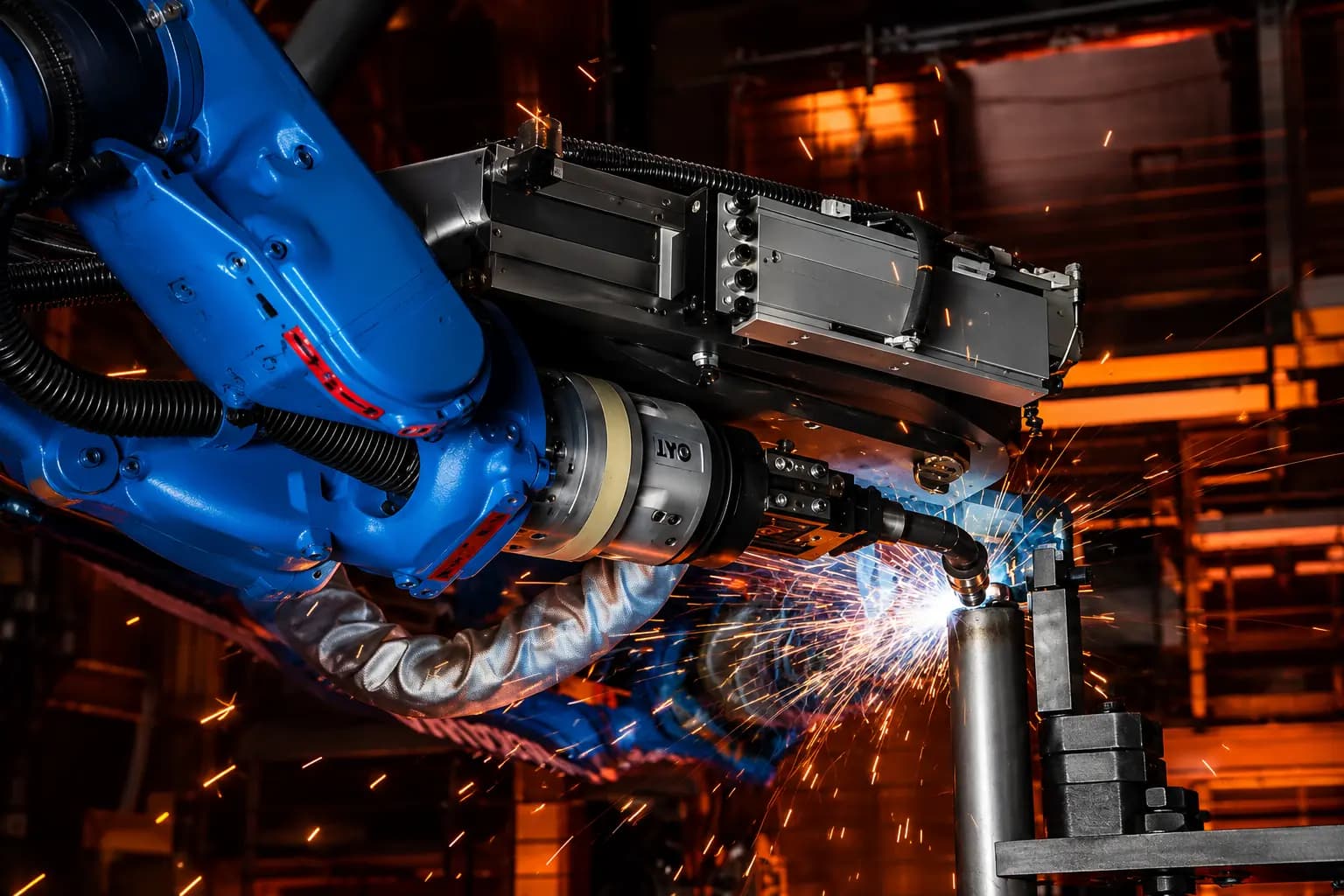 Welder joining steel with bright sparks in the fabrication shop