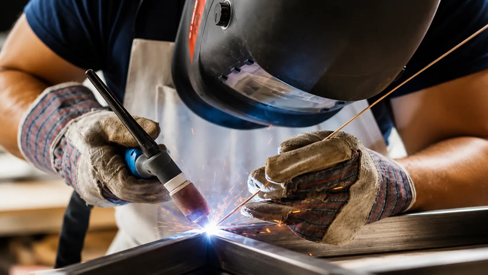 Skilled welder performing manual welding on a complex fit-up